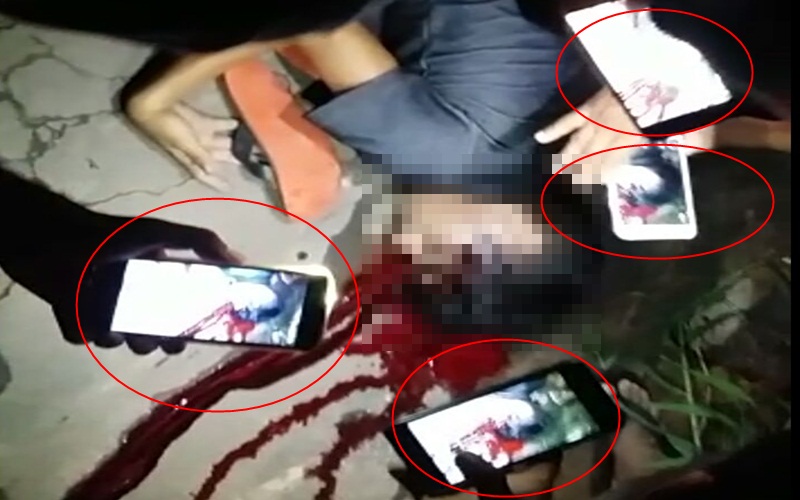 O ‘tal século XXI’: Em meio a tragédia, os celulares tomam de conta de um assassinato; CENAS FORTES