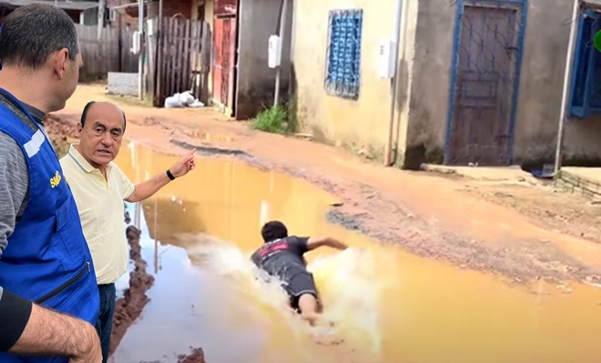 Jovem toma banho dentro de buraco de rua em forma de protesto em Rio Branco